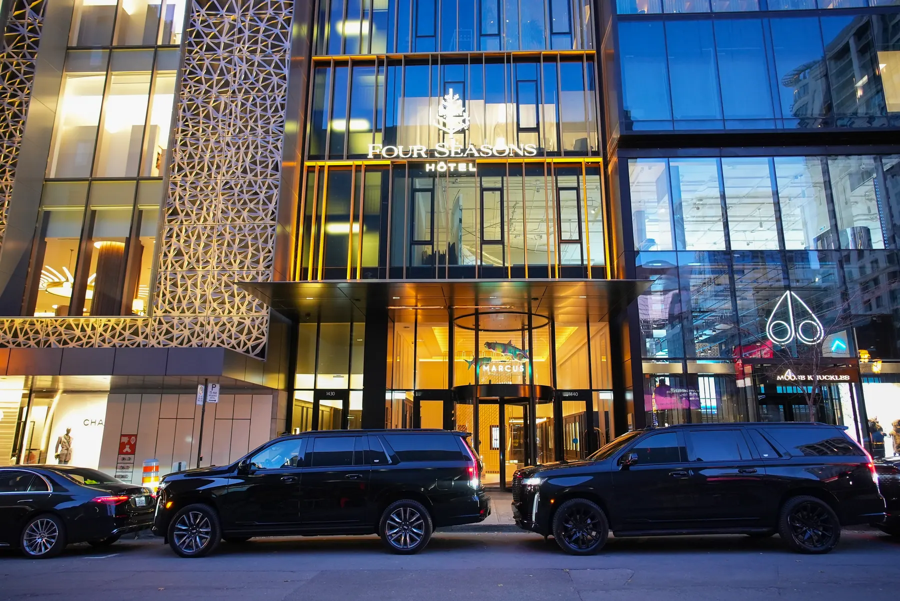 VIP Lane vehicles outside a modern Montreal hotel